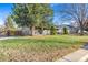 House exterior showcasing a well-maintained lawn and front porch at 3200 S Grape St, Denver, CO 80222