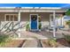 Inviting front porch with blue door and comfortable seating at 3200 S Grape St, Denver, CO 80222