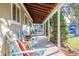 Relaxing front porch with wooden columns and seating at 3200 S Grape St, Denver, CO 80222