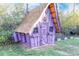 Charming purple playhouse in the backyard at 3200 S Grape St, Denver, CO 80222