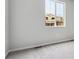 A bedroom with neutral paint, carpeted floors, and a bright window at 1464 Orchard St, Brighton, CO 80601