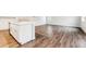 Bright kitchen featuring an island, stainless appliances, and white cabinets at 1464 Orchard St, Brighton, CO 80601