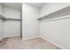 A walk-in closet with shelving and carpeted floors at 1464 Orchard St, Brighton, CO 80601