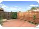 This backyard boasts a private patio, wooden fence, and low-maintenance landscaping at 2644 Devonshire Ct, Denver, CO 80229
