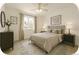 This stylish bedroom features a queen bed, contemporary furnishings, and bright natural light at 2644 Devonshire Ct, Denver, CO 80229