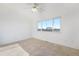 Light-filled bedroom boasts tile floors, ample space, and bright sunlight at 2644 Devonshire Ct, Denver, CO 80229