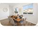 Bright dining room with large windows and stylish furniture. Ready for Gathering gatherings at 2644 Devonshire Ct, Denver, CO 80229