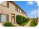 Charming townhome exterior featuring a well-maintained lawn and inviting front entrance with decorative wreath at 2644 Devonshire Ct, Denver, CO 80229