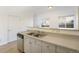 Bright kitchen featuring stainless steel appliances, double sink, and plenty of natural light at 2644 Devonshire Ct, Denver, CO 80229