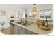 Bright kitchen featuring stainless steel appliances, double sink, and stylish decor at 2644 Devonshire Ct, Denver, CO 80229