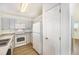 This kitchen features bright natural light, modern appliances, and sleek countertops at 2644 Devonshire Ct, Denver, CO 80229