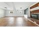 Spacious basement with fireplace, built-ins, and tiled flooring at 3608 S Newport Way, Denver, CO 80237