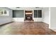 Large finished basement with decorative fireplace and built-in shelves at 3608 S Newport Way, Denver, CO 80237