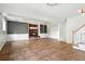 Open finished basement featuring a brick fireplace and built in storage shelves at 3608 S Newport Way, Denver, CO 80237