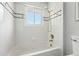 Clean bathroom with shower and tub with tile surround and gold shower fixtures at 3608 S Newport Way, Denver, CO 80237