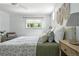 Bright bedroom featuring a ceiling fan, window, and neutral decor at 3608 S Newport Way, Denver, CO 80237