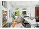 Elegant dining area with modern decor, and views of outdoor greenery at 3608 S Newport Way, Denver, CO 80237