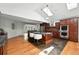 Open kitchen design with a center island, stainless appliances and wood floors at 3608 S Newport Way, Denver, CO 80237