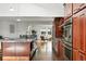 Gourmet kitchen with stainless steel appliances and granite center island at 3608 S Newport Way, Denver, CO 80237
