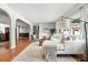 Cozy living room with a white sectional, area rug, hardwood floors, and a comfortable chair at 3608 S Newport Way, Denver, CO 80237
