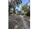 Charming single-story home with a pathway leading to the front door and mature shade trees in the front yard at 367 S Jasmine St, Denver, CO 80224