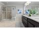 Modern bathroom with double vanity and shower at 18815 W 93Rd Ave, Arvada, CO 80007