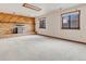 Finished basement recreation area with wood-burning stove at 1390 E Southern St, Brighton, CO 80601