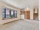 Living room with bay window, entryway, and staircase leading upstairs at 1390 E Southern St, Brighton, CO 80601