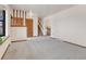 Living room showing entryway, staircase, and a view into adjacent room at 1390 E Southern St, Brighton, CO 80601