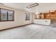 Bright living room with neutral carpeting and natural light at 1390 E Southern St, Brighton, CO 80601