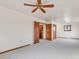 Main bedroom with ceiling fan and access to bathroom at 1390 E Southern St, Brighton, CO 80601