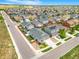 Aerial view of a large neighborhood showcasing houses with many different roof styles and solar panels at 581 Park Blvd, Brighton, CO 80603