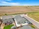 Aerial view of house showcasing backyard with a patio set, artificial lawn, and gazebo at 581 Park Blvd, Brighton, CO 80603