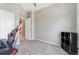 A minimalist room with neutral walls and carpet; an open doorway provides a glimpse of the interior at 581 Park Blvd, Brighton, CO 80603