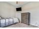 Cozy bedroom with a ceiling fan, a neutral color scheme, and modern furniture at 581 Park Blvd, Brighton, CO 80603