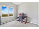 Neutral bedroom with a large window offering abundant natural light and views of the outdoors at 581 Park Blvd, Brighton, CO 80603