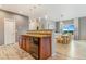 Kitchen features stainless steel appliances, a sink, and an eat-in area with a modern chandelier at 581 Park Blvd, Brighton, CO 80603