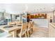 Living space with an open floor plan featuring an adjacent dining area and views into the kitchen at 581 Park Blvd, Brighton, CO 80603