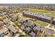 Aerial view of homes in a residential neighborhood with a large school building nearby at 8865 E 28Th Ave, Denver, CO 80238