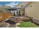 Backyard patio featuring a brick retaining wall and an outdoor dining set at 8865 E 28Th Ave, Denver, CO 80238