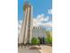 This exterior showcases the unique architecture of the FlyteCo Tower against a bright sky with minimal trees at 8865 E 28Th Ave, Denver, CO 80238