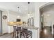 Bright kitchen features a breakfast bar with pendant lighting and stainless steel appliances at 8865 E 28Th Ave, Denver, CO 80238