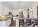 Kitchen offers stainless appliances, stone countertops, and a breakfast bar at 8865 E 28Th Ave, Denver, CO 80238