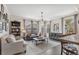 Bright living room with large windows, an area rug, and modern decor at 8865 E 28Th Ave, Denver, CO 80238