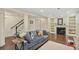 Cozy living room with comfortable seating, a fireplace, and elegant decor at 8865 E 28Th Ave, Denver, CO 80238