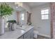 Bright bathroom with a large mirror, and a shower with red decor at 1206 Sugarloaf Ln, Erie, CO 80516