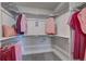 Well-organized walk-in closet with ample storage space, shelving, and hanging rods at 1206 Sugarloaf Ln, Erie, CO 80516