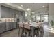 Stylish kitchen featuring stainless steel appliances, large island with seating and an open-concept design at 1206 Sugarloaf Ln, Erie, CO 80516