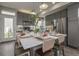 Modern kitchen with stainless steel appliances, gray cabinets, and a large island with seating at 1206 Sugarloaf Ln, Erie, CO 80516