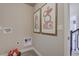 Laundry area features modern art, new paint, and plenty of space for folding and organization at 1206 Sugarloaf Ln, Erie, CO 80516